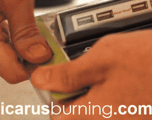 GIF of a household hack showing how to open tough plastic packaging with a can opener